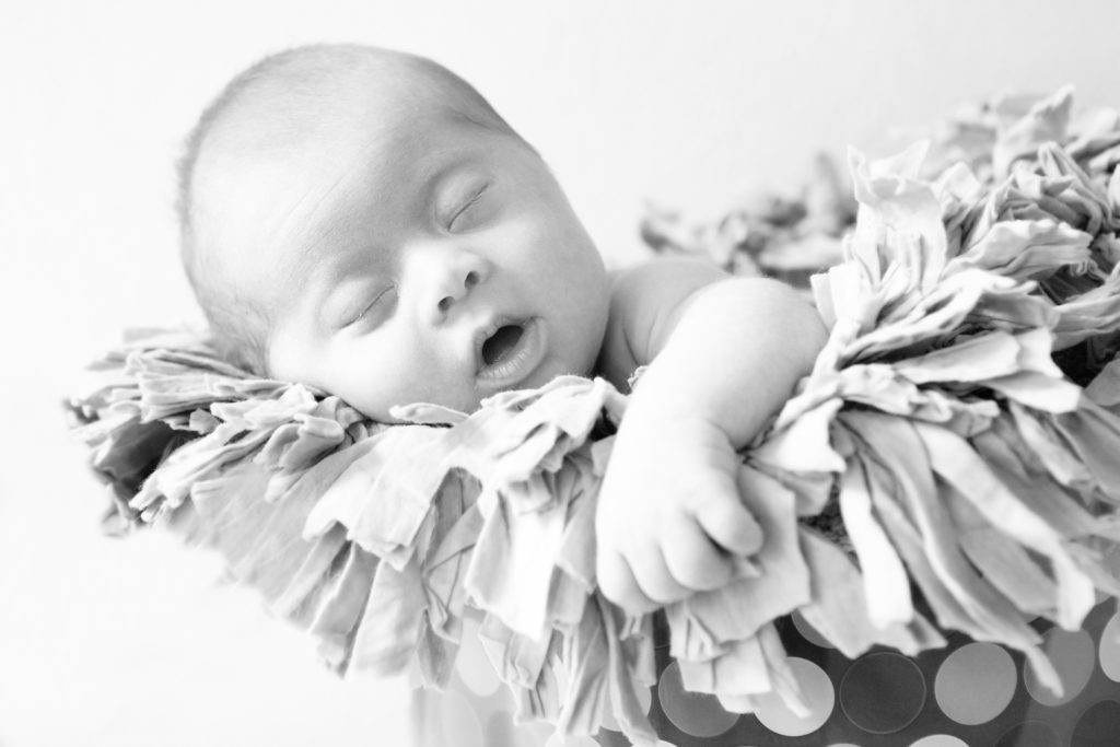 A cute photo of newborn Everett with a cute expression on his face.