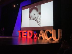 A picture of the TEDxACU stage, and Everett's photo up on the big screen!